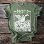 Green t-shirt with a white graphic of a goose and the words "become ungovernable".