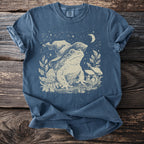 Blue t-shirt with a cream line art print of a frog wearing a wizard hat.