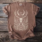 Brown t-shirt with a cream graphic of a raven on deer antlers, skull, and occult imagery.