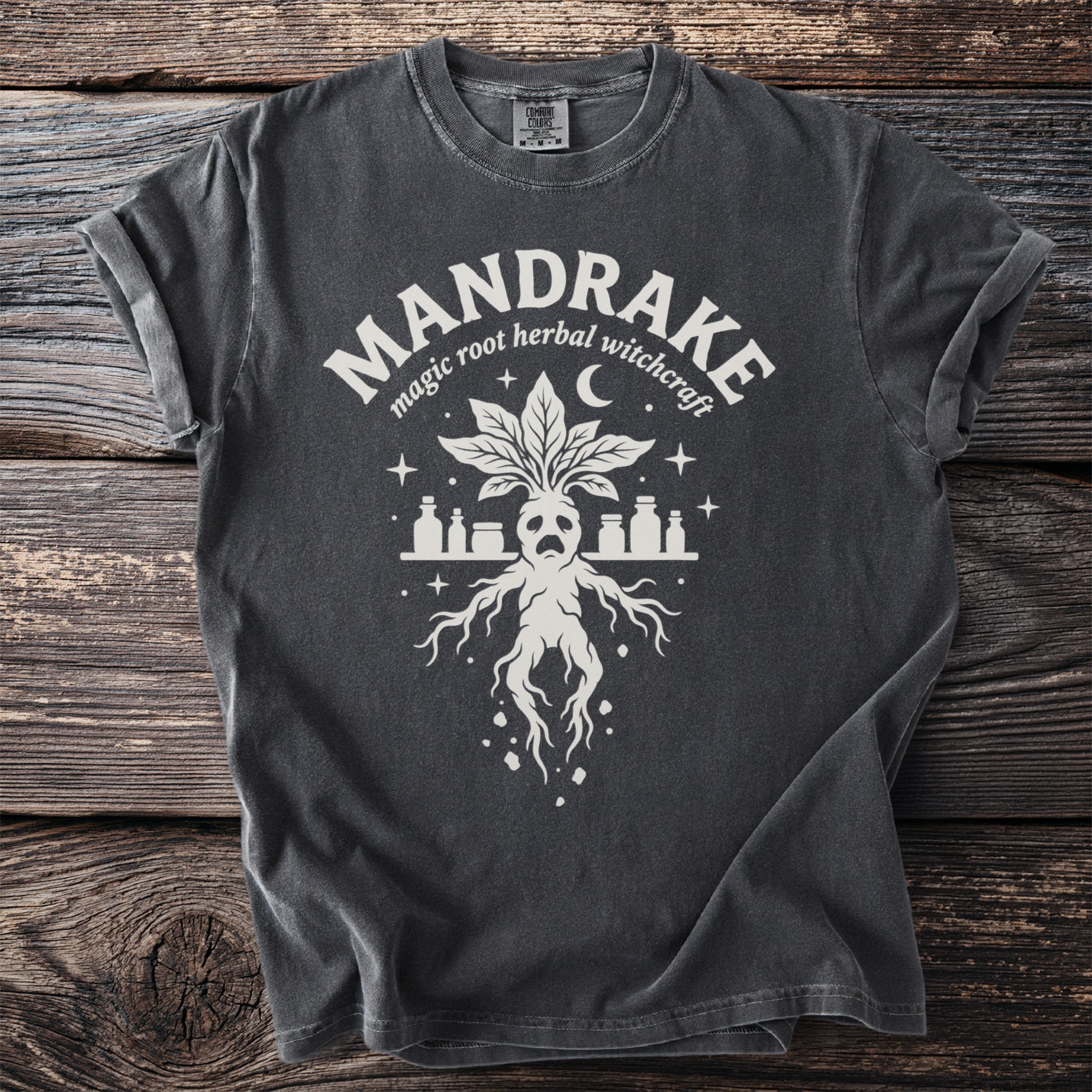 Charcoal t-shirt with a white graphic of a mandrake and potion bottles.