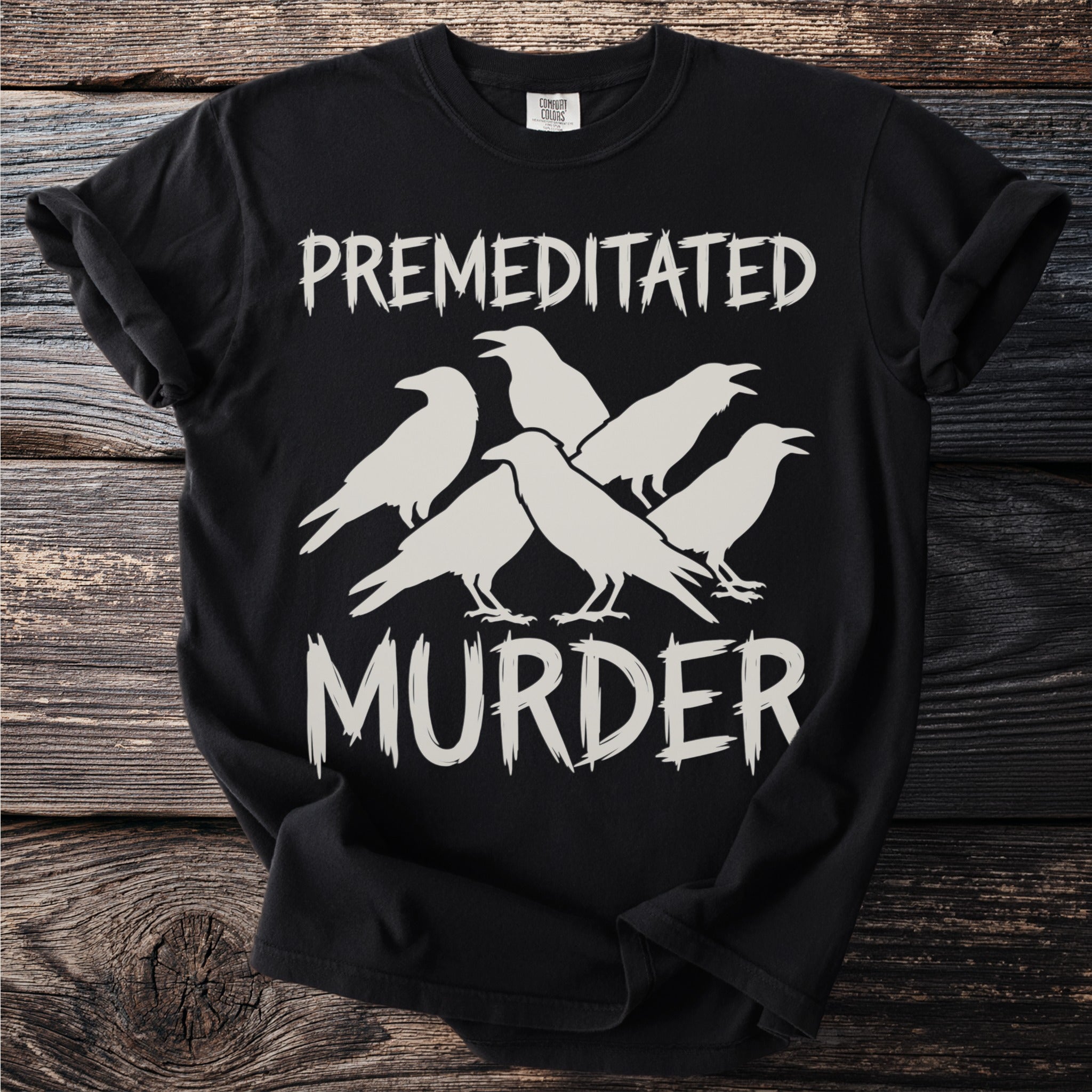 Black t-shirt with white text "PREMEDITATED MURDER" and silhouette of five crows.