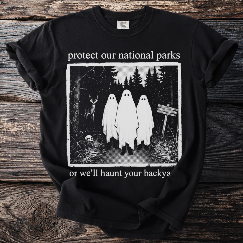 Black t-shirt with "protect our national parks or we'll haunt your backy" text and ghost graphic.
