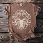 Brown t-shirt with a circular design featuring ram skull, two ravens, and runes.