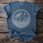Denim t-shirt with a white circular nature design featuring a dragonfly and moon.