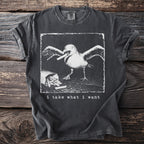 Dark t-shirt with graphic of a seagull eating french fries, text "i take what i want".