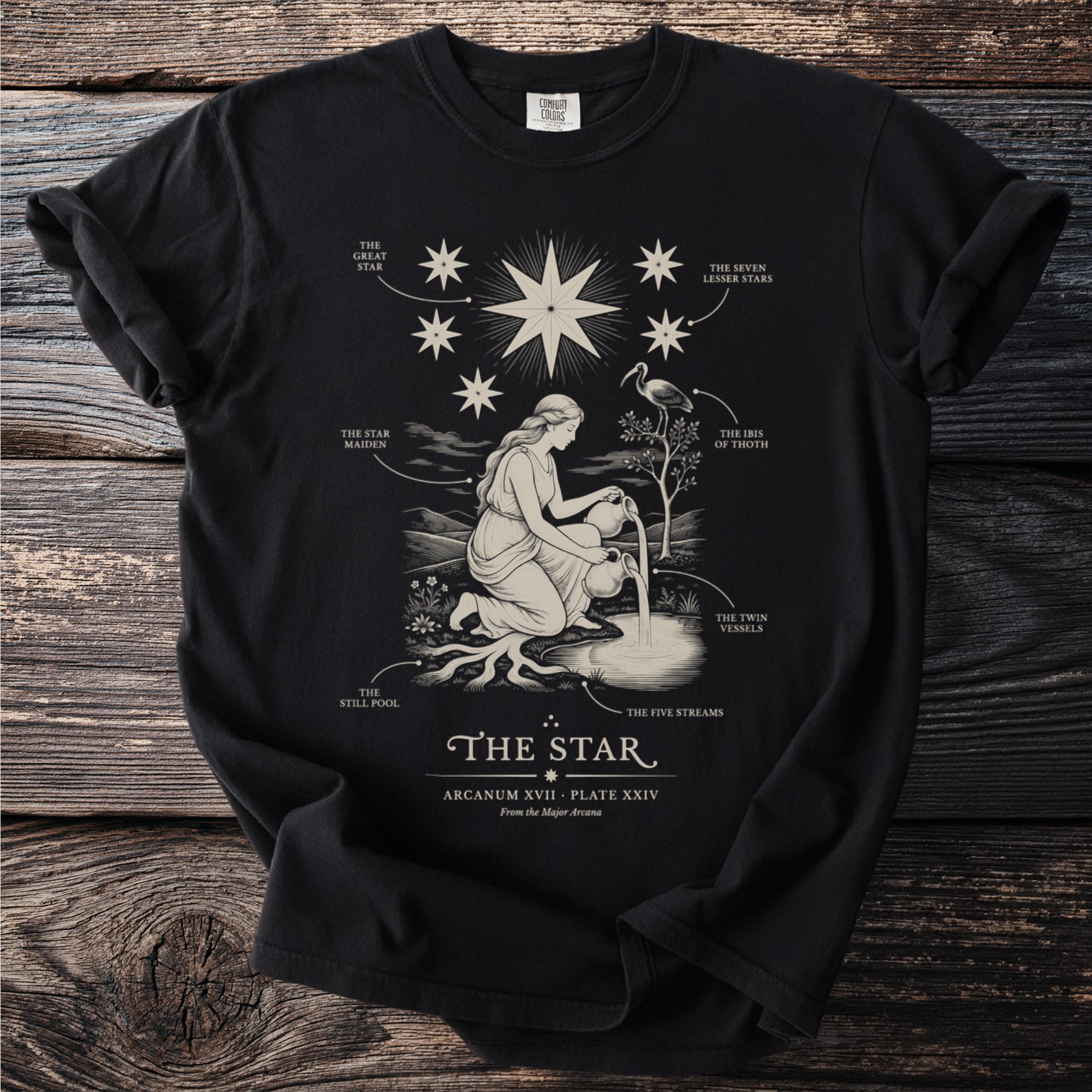 T-shirt with "The Star" tarot card illustration and text details.