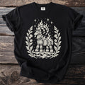 Black t-shirt with a straw goat on fire design surrounded by thistles and stars.