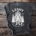 Dark grey t-shirt with white graphic featuring "LESHY" text above a woodland creature.