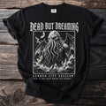 Black t-shirt with "Dead But Dreaming" text and tentacled creature graphic.