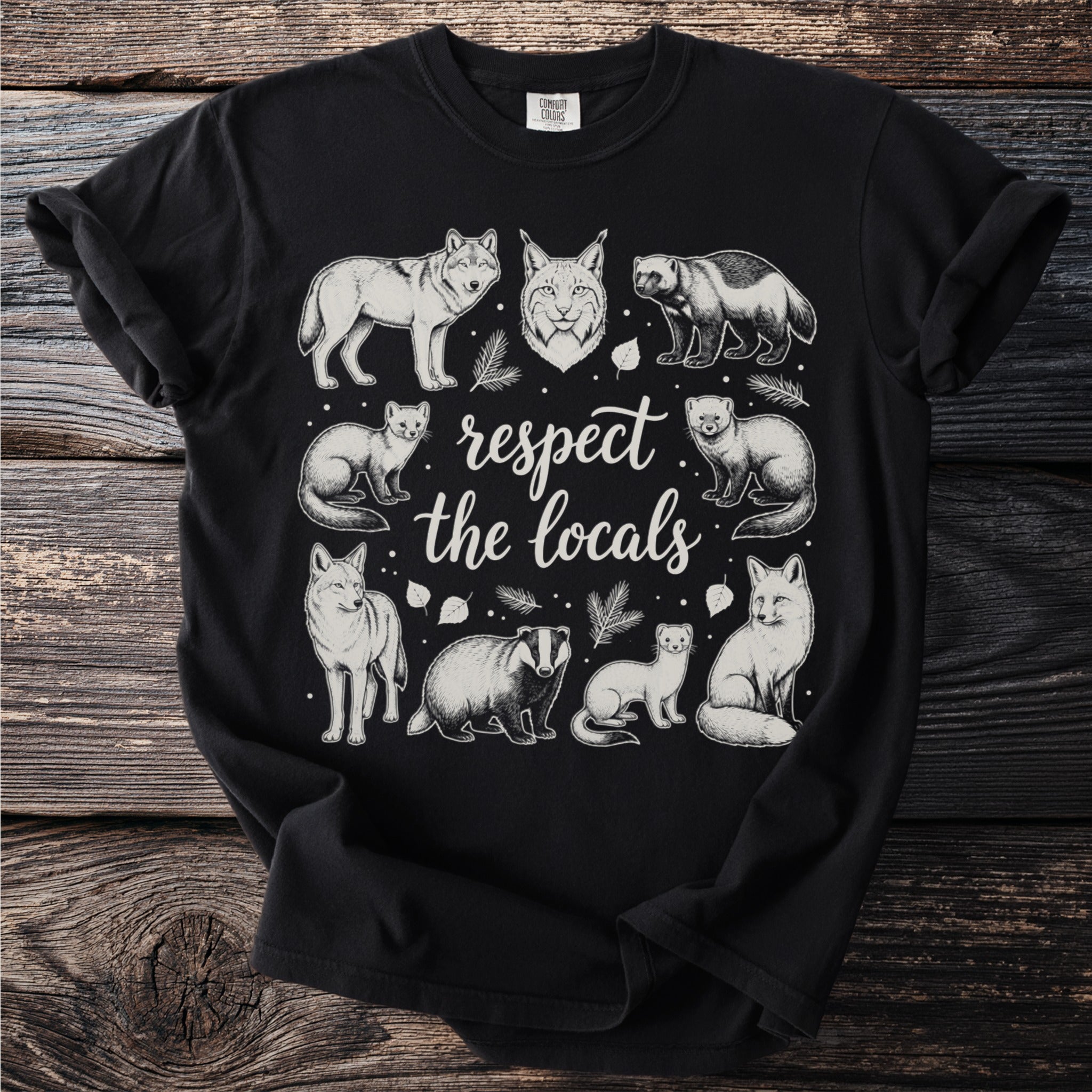 Black t-shirt with white illustration of wild animals and text "respect the locals".