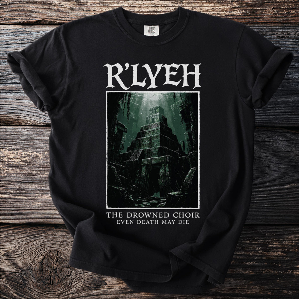 Black t-shirt with R'LYEH and dark pyramid illustration, text "THE DROWNED CHOIR EVEN DEATH MAY DIE".