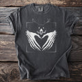 Dark grey t-shirt with skeleton hands forming a heart and a horned skull graphic.
