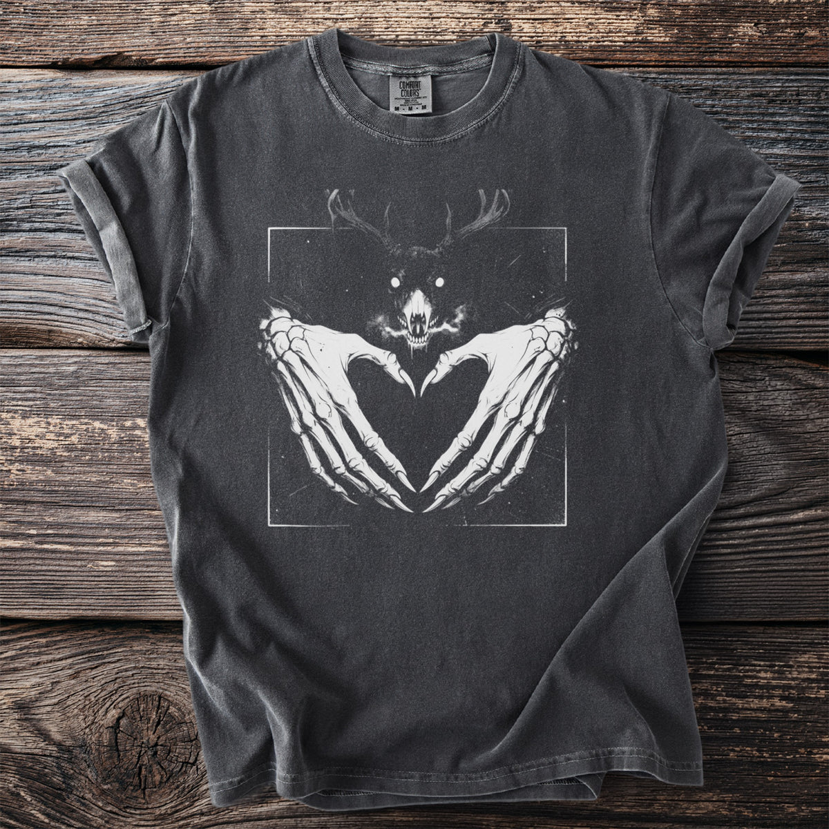 Dark grey t-shirt with skeleton hands forming a heart and a horned skull graphic.