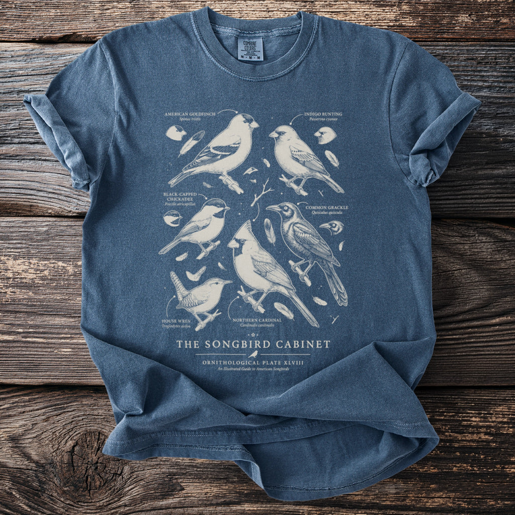 T-shirt with vintage illustration of six songbirds and text "THE SONGBIRD CABINET".
