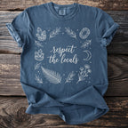 Blue t-shirt with white graphic text "respect the locals" and nature illustrations.