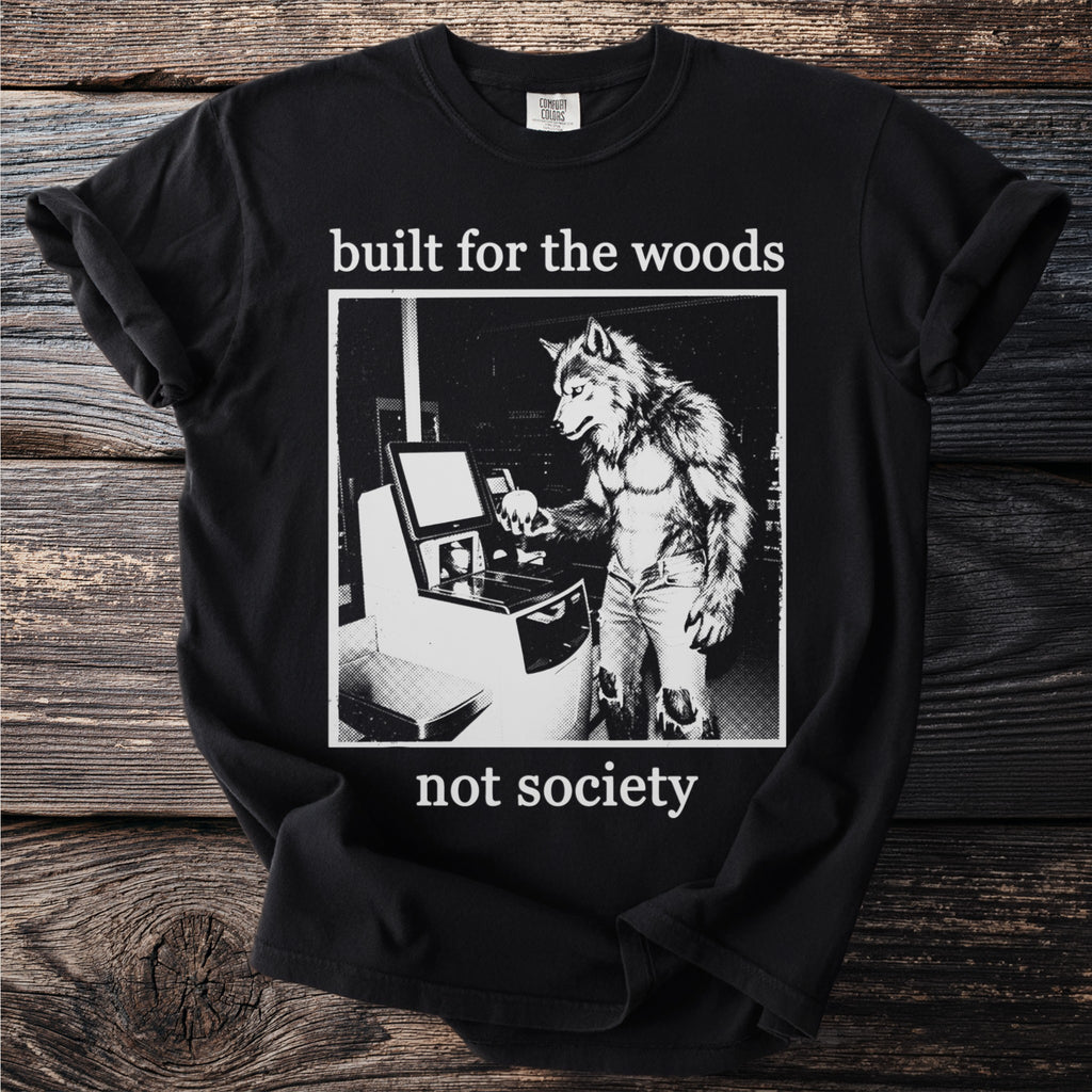 Black t-shirt with a werewolf at a self-checkout, text reads "built for the woods not society."