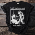 Black t-shirt with a werewolf at a self-checkout, text reads "built for the woods not society."