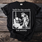 Black t-shirt with a werewolf at a self-checkout, text reads "built for the woods not society."