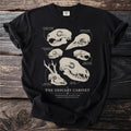 Black t-shirt featuring "The Ossuary Cabinet" text and illustrations of animal skulls.
