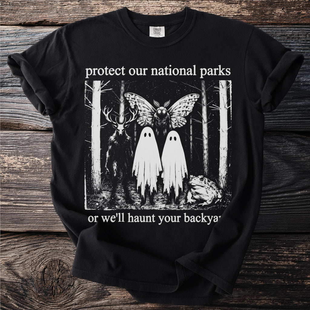 Black t-shirt with "protect our national parks" and spooky forest creatures.