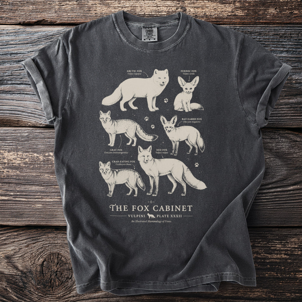 T-shirt featuring an illustration of various fox species with their scientific names.