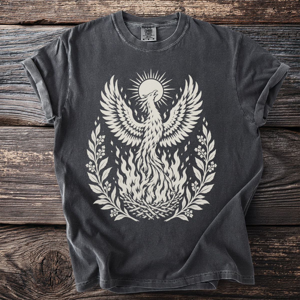 Dark grey t-shirt with a cream phoenix rising from flames and a sun graphic.