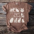 Brown t-shirt with graphic of various cats and text "respect the locals".