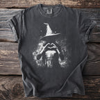 Dark t-shirt with white graphic of a witch making a heart shape with her hands.
