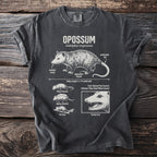 T-shirt with detailed opossum illustration, labeling its body parts and behaviors.