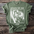 Olive green t-shirt with werewolf graphic and text "please let me rest."