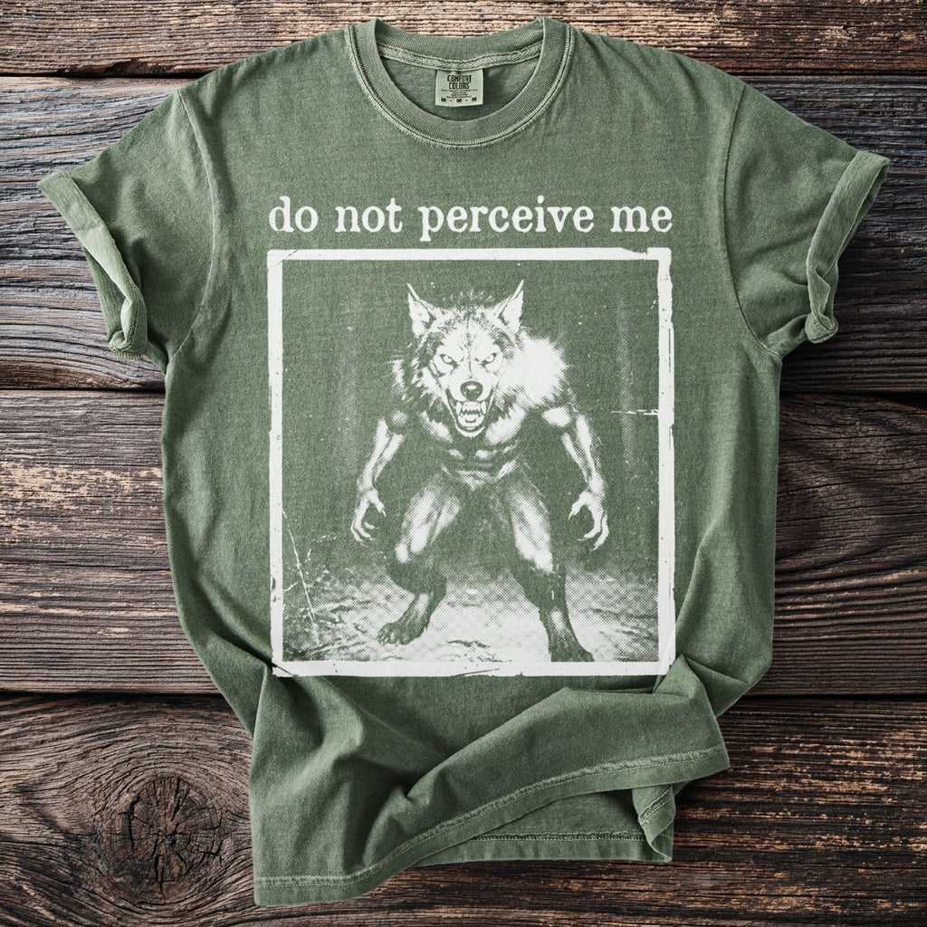 Green t-shirt with "do not perceive me" text and a werewolf graphic.