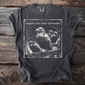 T-shirt with four ravens on a fence and the text "support your local unkindness".