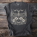 Dark gray t-shirt with a white celestial dragonfly, moths, moon, and floral design.