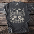 Dark gray t-shirt with a white celestial dragonfly, moths, moon, and floral design.