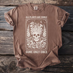 Brown t-shirt with skull and floral design, text says "All Plants Are Edible".