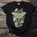 Black t-shirt with a light green luna moth and floral design.