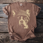 Brown t-shirt with a graphic of a French bulldog wearing a beanie.