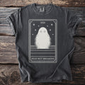 Dark t-shirt with a tarot card design featuring a ghost and "DEAD BUT DREAMING" text.