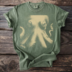 Green t-shirt with a vintage tan octopus graphic and Comfort Colors tag.