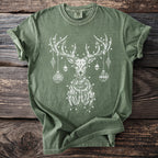 Green t-shirt with a white skeleton reindeer adorned with ornaments and lights.
