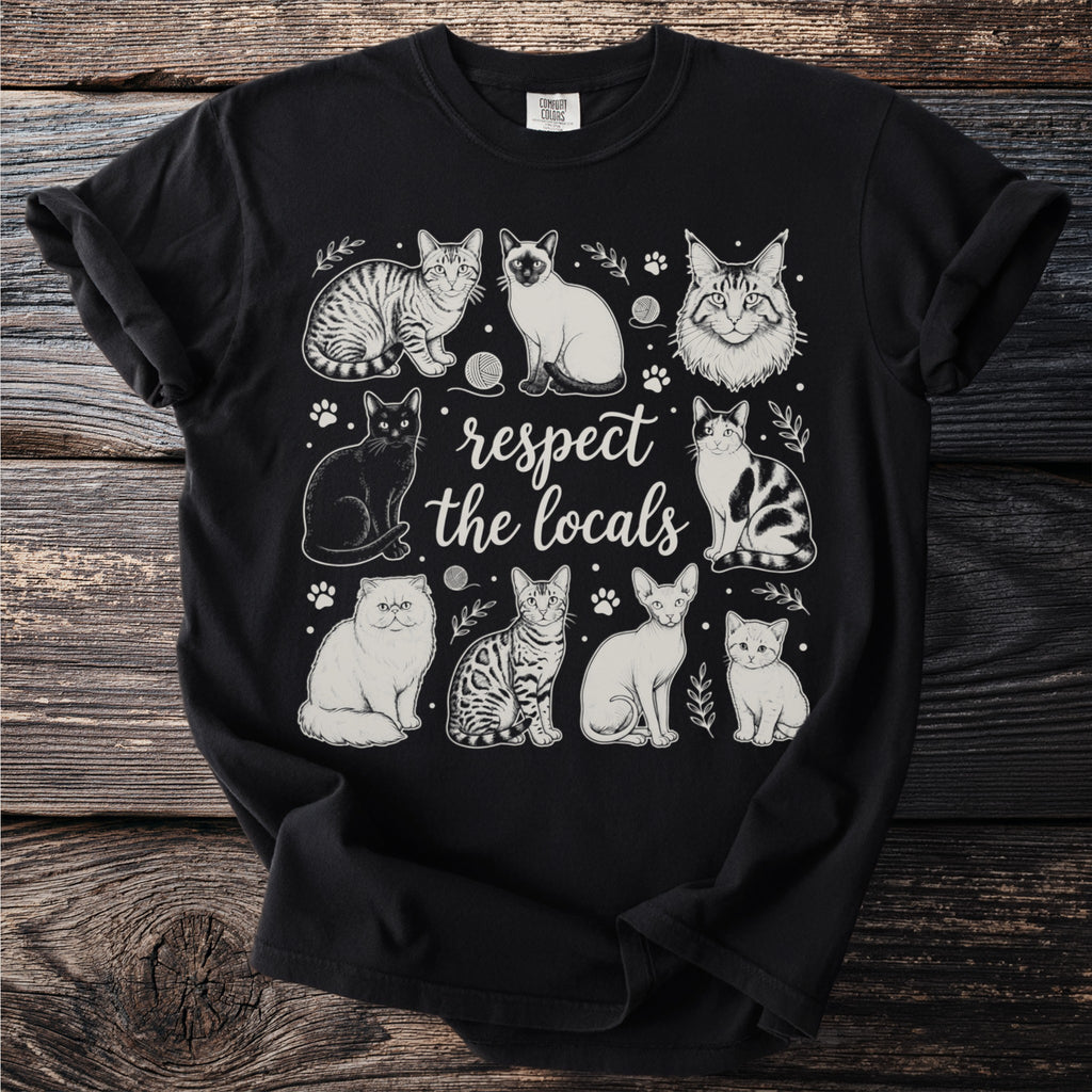 Black t-shirt with vintage-style line art of various cats and "respect the locals" text.