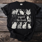 Black t-shirt with vintage-style line art of various cats and "respect the locals" text.