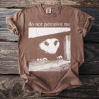 Brown t-shirt with "do not perceive me" and opossum graphic.
