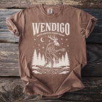Brown t-shirt with "WENDIGO north american cryptid legend" and a skeletal deer-like creature.