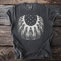 Dark t-shirt with a circle of hooded figures and stars design.