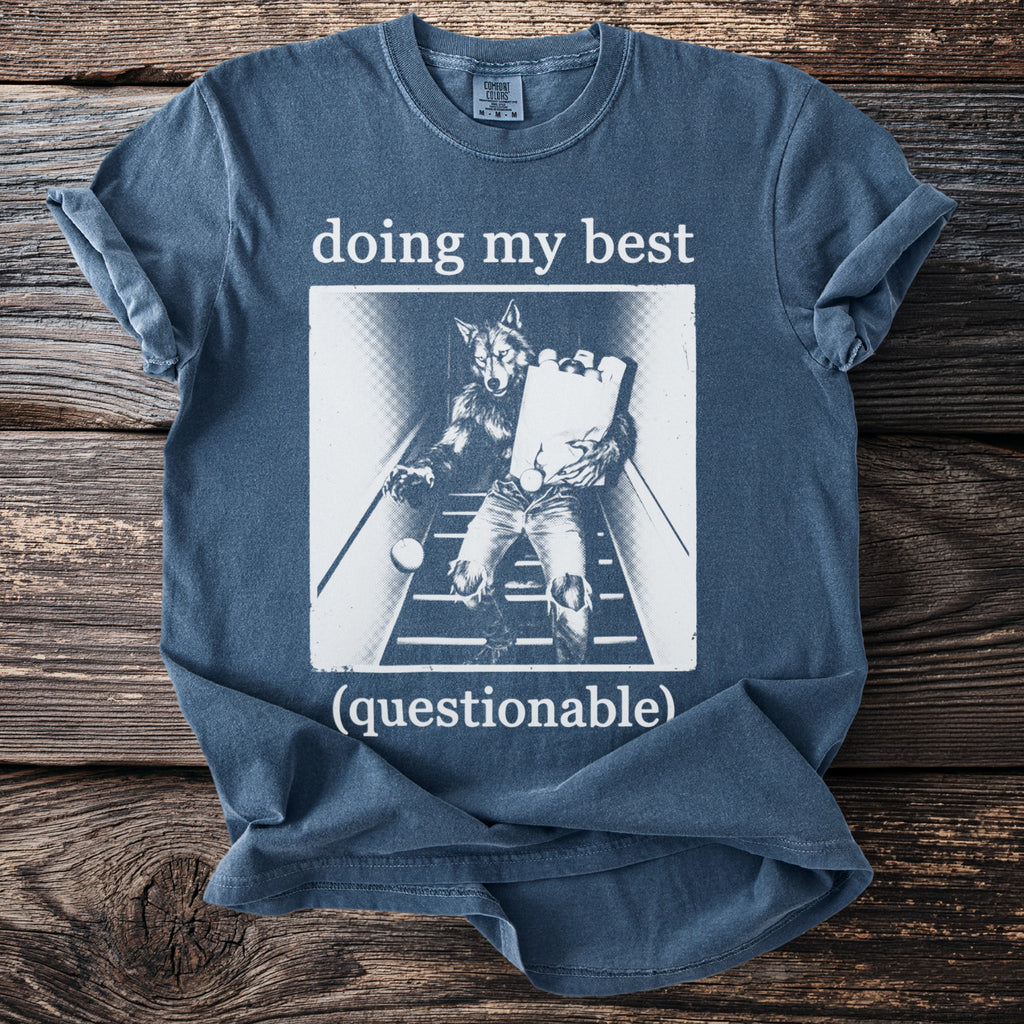 Blue t-shirt with "doing my best (questionable)" text and werewolf graphic.
