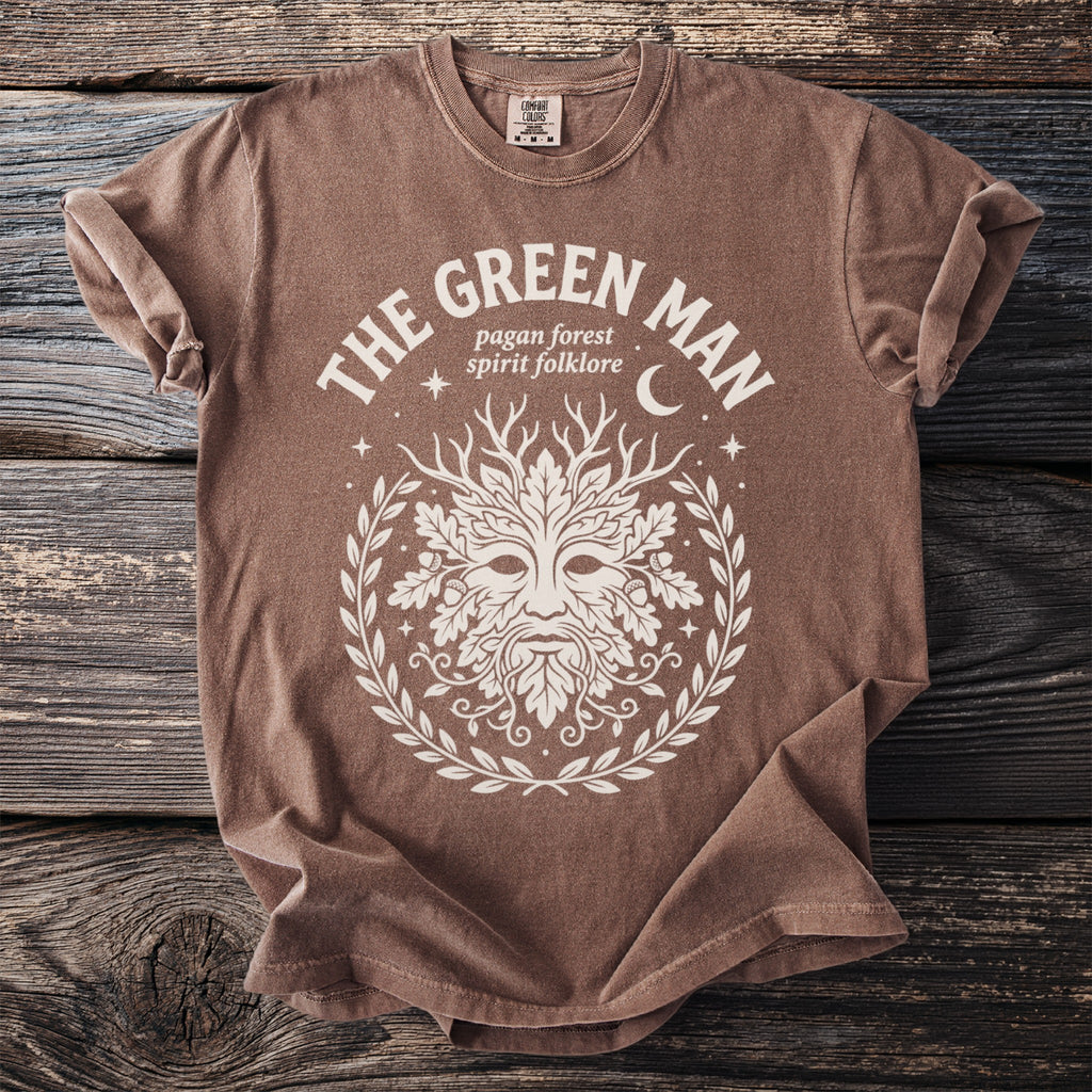 Brown t-shirt with white "The Green Man" graphic and pagan folklore symbols.