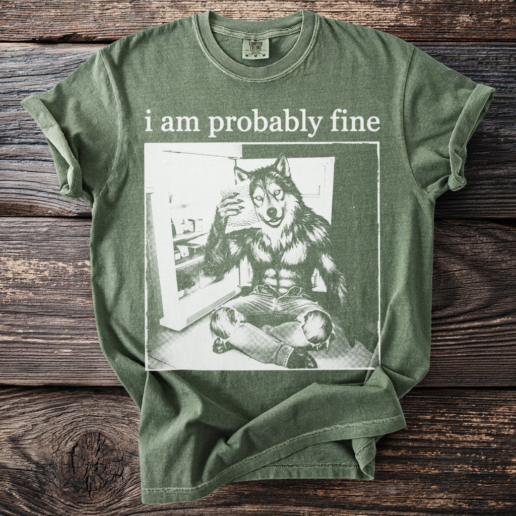 Green t-shirt with "i am probably fine" and a wolf man holding ice.
