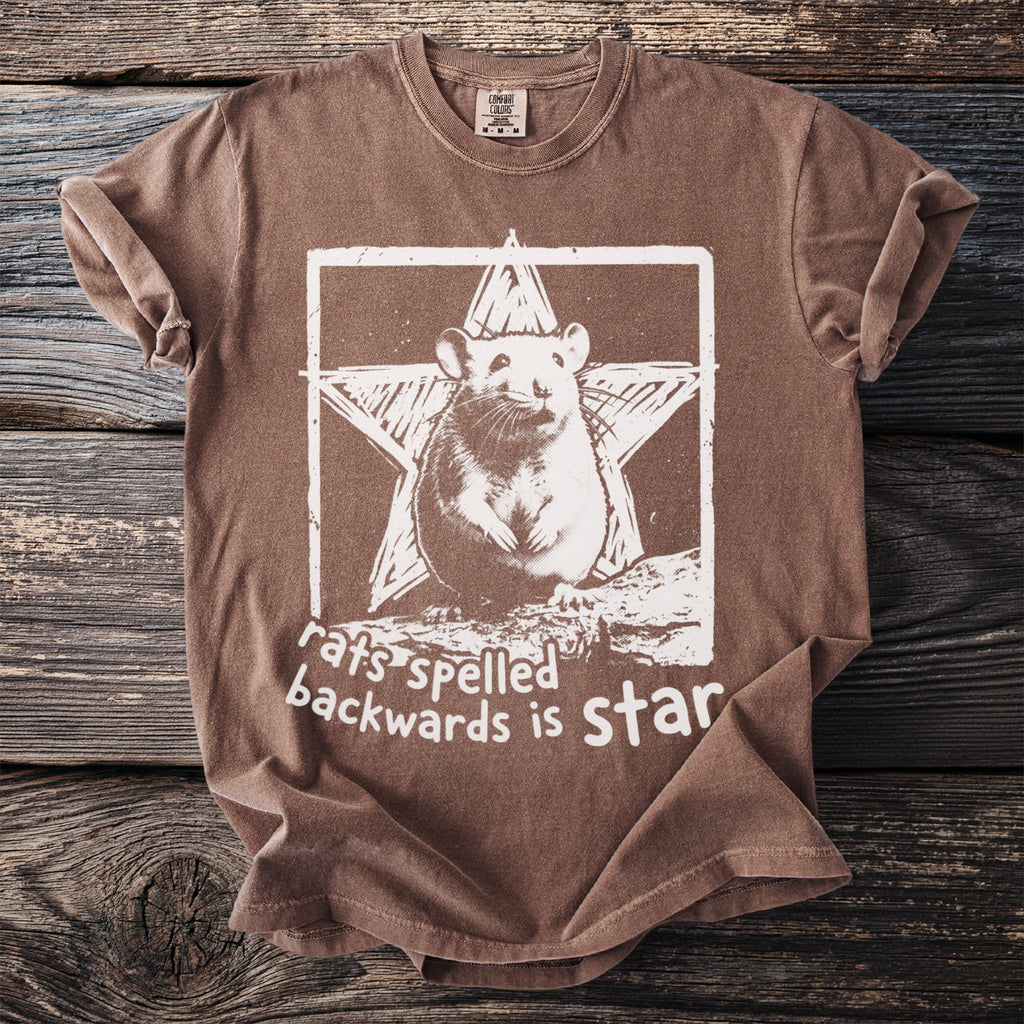 Brown t-shirt with a white graphic of a rat in a star and text reading "rats backwards is star".