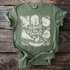 Green t-shirt with white graphic of arctic animals and "respect the locals" text.